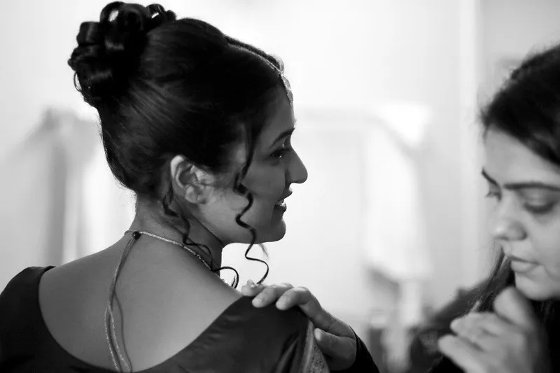 Side profile bridal hairstyle and wedding makeup look